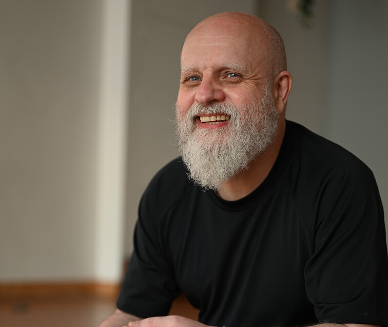 Austin Ince Headshot with the Streatham Yogarise studio in the background.