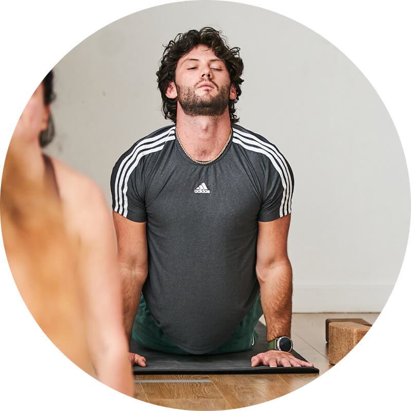 A man practicing Yoga in Yogarise Streatham