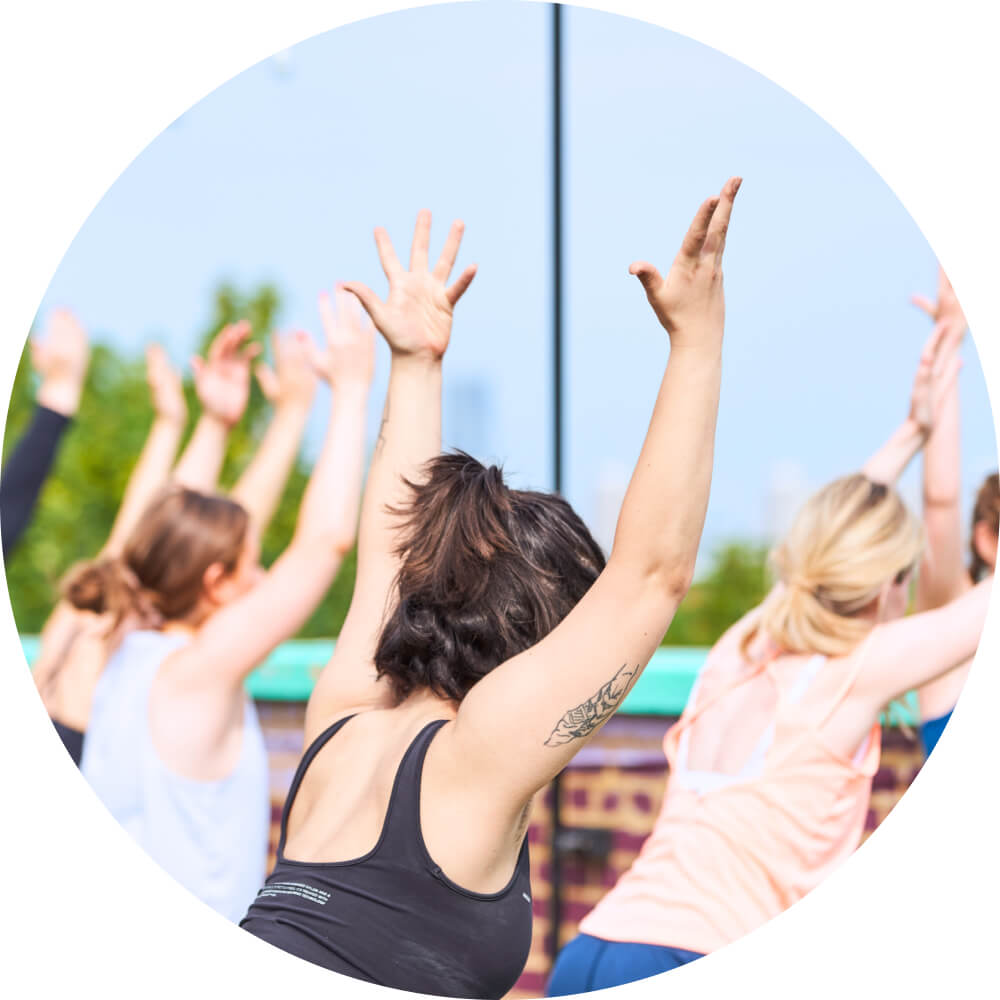 Someone practising rooftop Yoga at the Bussey Building in Peckham