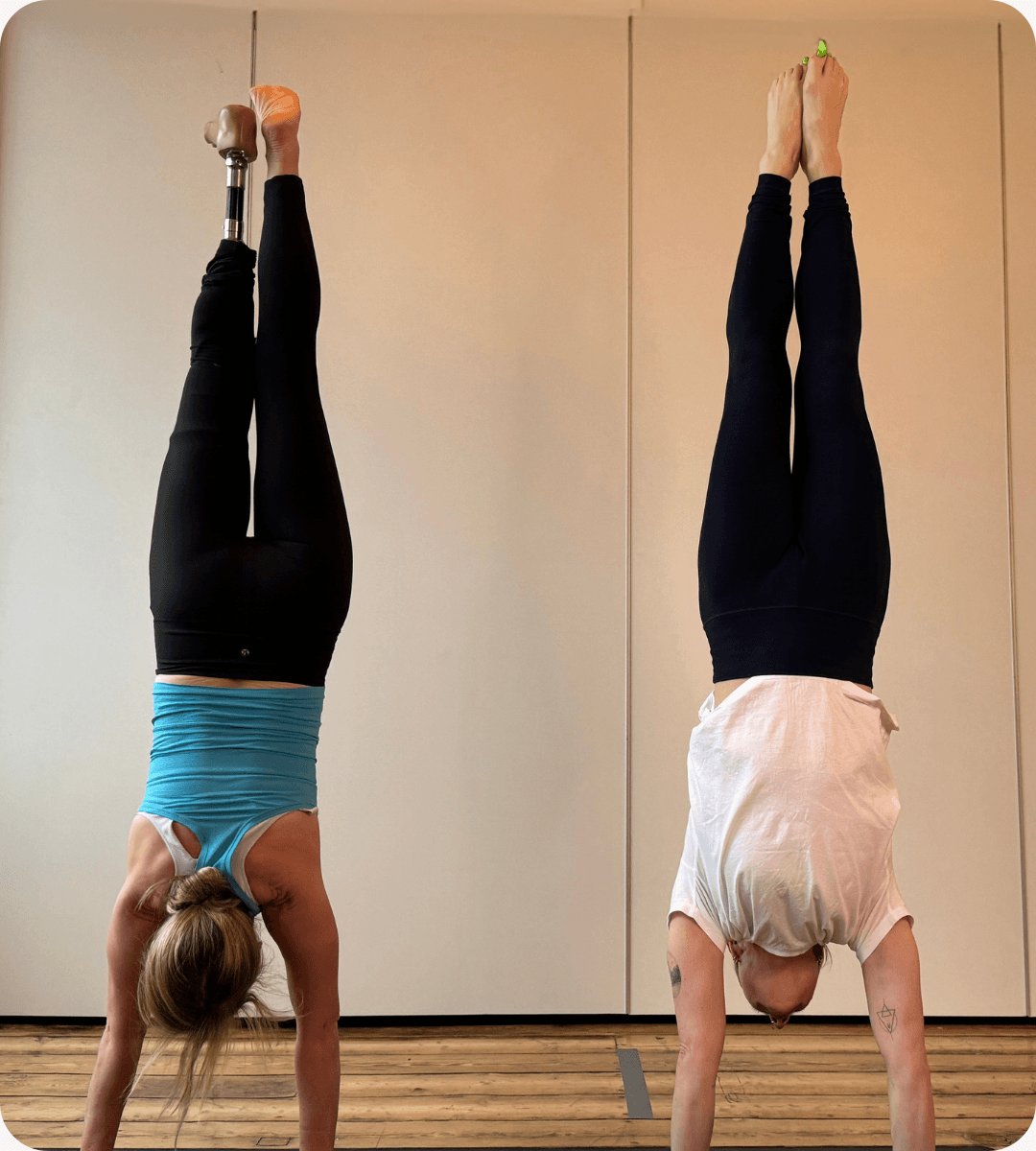 Side by side teachers in handstand